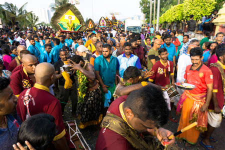 BATU CAVES, MALAYSIA - January 21, 2019: A celebration and devotee carrying kavadi preparing for ceremony prayers blessings during Thaipusam festival.のeditorial素材