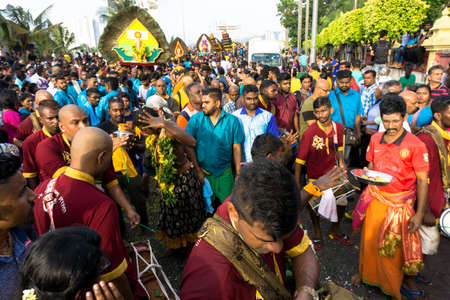 BATU CAVES, MALAYSIA - January 21, 2019: A celebration and devotee carrying kavadi preparing for ceremony prayers blessings during Thaipusam festival.のeditorial素材