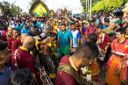 BATU CAVES, MALAYSIA - January 21, 2019: A celebration and devotee carrying kavadi preparing for ceremony prayers blessings during Thaipusam festival.のeditorial素材