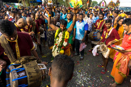 BATU CAVES, MALAYSIA - January 21, 2019: A celebration and devotee carrying kavadi preparing for ceremony prayers blessings during Thaipusam festival.のeditorial素材
