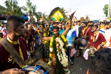 BATU CAVES, MALAYSIA - January 21, 2019: A celebration and devotee carrying kavadi preparing for ceremony prayers blessings during Thaipusam festival.のeditorial素材