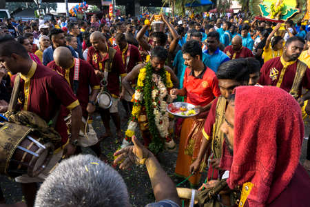 BATU CAVES, MALAYSIA - January 21, 2019: A celebration and devotee carrying kavadi preparing for ceremony prayers blessings during Thaipusam festival.のeditorial素材