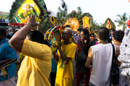 BATU CAVES, MALAYSIA - January 21, 2019: A celebration and devotee carrying kavadi preparing for ceremony prayers blessings during Thaipusam festival.のeditorial素材
