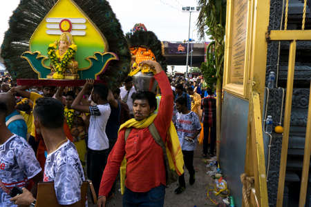 BATU CAVES, MALAYSIA - January 21, 2019: A celebration and devotee carrying kavadi preparing for ceremony prayers blessings during Thaipusam festival.のeditorial素材