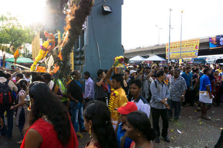 BATU CAVES, MALAYSIA - January 21, 2019: A celebration and devotee carrying kavadi preparing for...