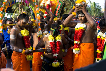 BATU CAVES, MALAYSIA - January 21, 2019: A celebration and devotee carrying kavadi preparing for ceremony prayers blessings during Thaipusam festival.のeditorial素材