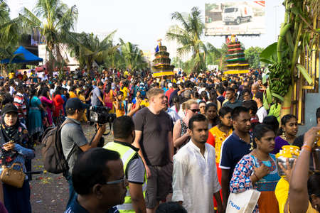 BATU CAVES, MALAYSIA - January 21, 2019: A celebration and devotee carrying kavadi preparing for ceremony prayers blessings during Thaipusam festival.のeditorial素材
