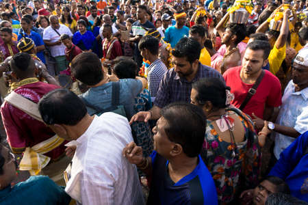 BATU CAVES, MALAYSIA - January 21, 2019: A celebration and devotee carrying kavadi preparing for ceremony prayers blessings during Thaipusam festival.のeditorial素材