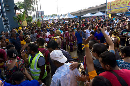 BATU CAVES, MALAYSIA - January 21, 2019: A celebration and devotee carrying kavadi preparing for ceremony prayers blessings during Thaipusam festival.のeditorial素材