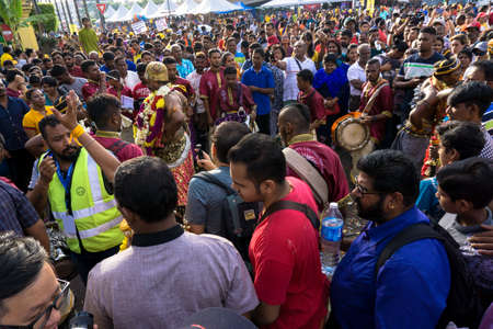 BATU CAVES, MALAYSIA - January 21, 2019: A celebration and devotee carrying kavadi preparing for ceremony prayers blessings during Thaipusam festival.のeditorial素材