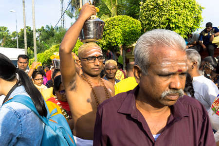 BATU CAVES, MALAYSIA - January 21, 2019: A celebration and devotee carrying kavadi preparing for ceremony prayers blessings during Thaipusam festival.のeditorial素材