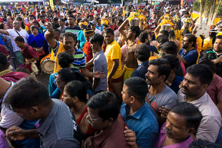 BATU CAVES, MALAYSIA - January 21, 2019: A celebration and devotee carrying kavadi preparing for ceremony prayers blessings during Thaipusam festival.のeditorial素材