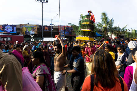 BATU CAVES, MALAYSIA - January 21, 2019: A celebration and devotee carrying kavadi preparing for ceremony prayers blessings during Thaipusam festival.のeditorial素材