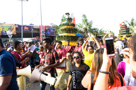 BATU CAVES, MALAYSIA - January 21, 2019: A celebration and devotee carrying kavadi preparing for ceremony prayers blessings during Thaipusam festival.のeditorial素材