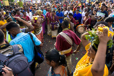 BATU CAVES, MALAYSIA - January 21, 2019: A celebration and devotee carrying kavadi preparing for ceremony prayers blessings during Thaipusam festival.のeditorial素材