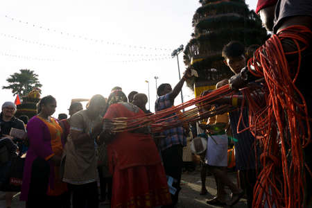 BATU CAVES, MALAYSIA - January 21, 2019: A celebration and devotee carrying kavadi preparing for...