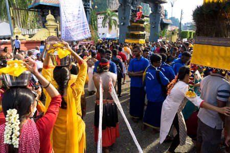 BATU CAVES, MALAYSIA - January 21, 2019: A celebration and devotee carrying kavadi preparing for ceremony prayers blessings during Thaipusam festival.のeditorial素材