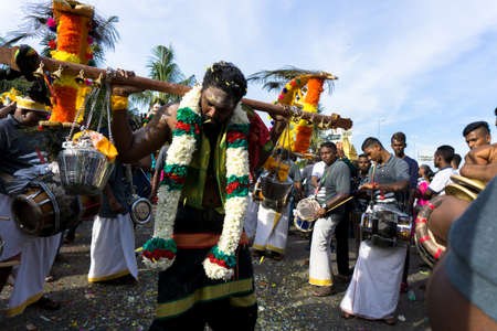 BATU CAVES, MALAYSIA - January 21, 2019: A celebration and devotee carrying kavadi preparing for...