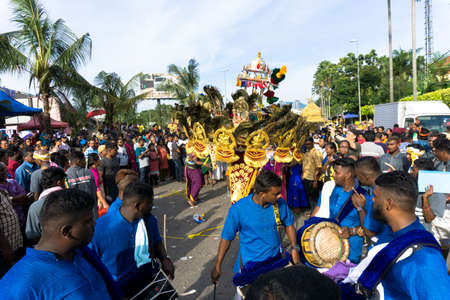 BATU CAVES, MALAYSIA - January 21, 2019: A celebration and devotee carrying kavadi preparing for ceremony prayers blessings during Thaipusam festival.のeditorial素材