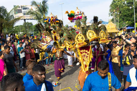BATU CAVES, MALAYSIA - January 21, 2019: A celebration and devotee carrying kavadi preparing for...