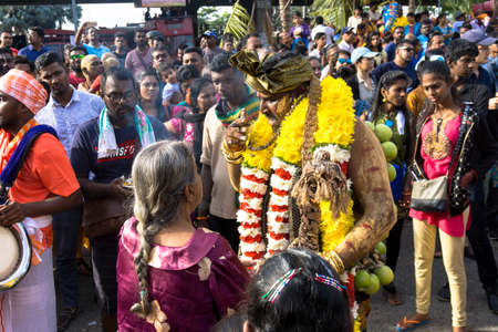 BATU CAVES, MALAYSIA - January 21, 2019: A celebration and devotee carrying kavadi preparing for ceremony prayers blessings during Thaipusam festival.のeditorial素材