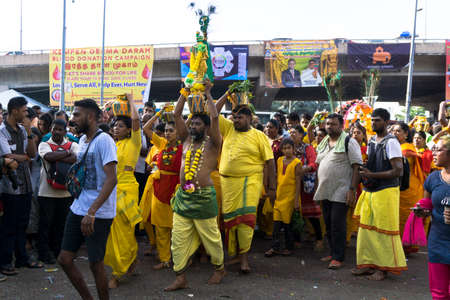BATU CAVES, MALAYSIA - January 21, 2019: A celebration and devotee carrying kavadi preparing for ceremony prayers blessings during Thaipusam festival.のeditorial素材
