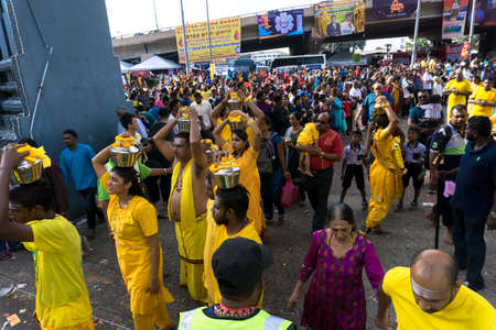 BATU CAVES, MALAYSIA - January 21, 2019: A celebration and devotee carrying kavadi preparing for ceremony prayers blessings during Thaipusam festival.のeditorial素材