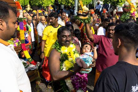 BATU CAVES, MALAYSIA - January 21, 2019: A celebration and devotee carrying kavadi preparing for ceremony prayers blessings during Thaipusam festival.のeditorial素材