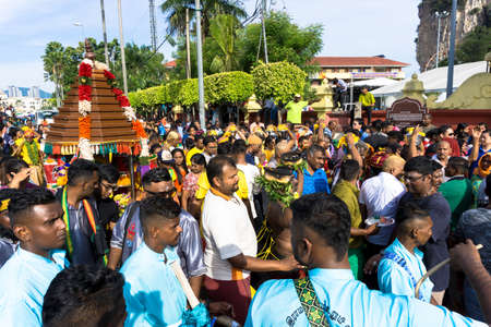 BATU CAVES, MALAYSIA - January 21, 2019: A celebration and devotee carrying kavadi preparing for ceremony prayers blessings during Thaipusam festival.のeditorial素材