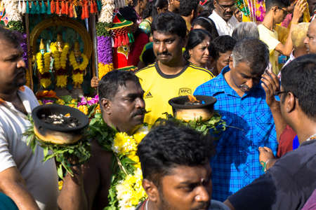 BATU CAVES, MALAYSIA - January 21, 2019: A celebration and devotee carrying kavadi preparing for ceremony prayers blessings during Thaipusam festival.のeditorial素材