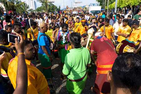 BATU CAVES, MALAYSIA - January 21, 2019: A celebration and devotee carrying kavadi preparing for ceremony prayers blessings during Thaipusam festival.のeditorial素材