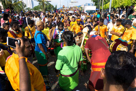 BATU CAVES, MALAYSIA - January 21, 2019: A celebration and devotee carrying kavadi preparing for ceremony prayers blessings during Thaipusam festival.のeditorial素材