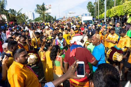 BATU CAVES, MALAYSIA - January 21, 2019: A celebration and devotee carrying kavadi preparing for ceremony prayers blessings during Thaipusam festival.のeditorial素材