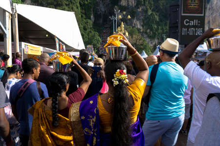 BATU CAVES, MALAYSIA - January 21, 2019: A celebration and devotee carrying kavadi preparing for ceremony prayers blessings during Thaipusam festival.のeditorial素材