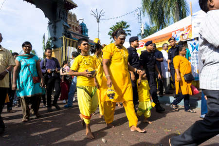 BATU CAVES, MALAYSIA - January 21, 2019: A celebration and devotee carrying kavadi preparing for...