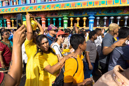 BATU CAVES, MALAYSIA - January 21, 2019: A celebration and devotee carrying kavadi preparing for ceremony prayers blessings during Thaipusam festival.のeditorial素材