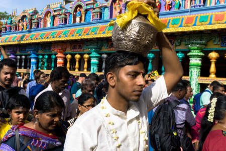 BATU CAVES, MALAYSIA - January 21, 2019: A celebration and devotee carrying kavadi preparing for ceremony prayers blessings during Thaipusam festival.のeditorial素材