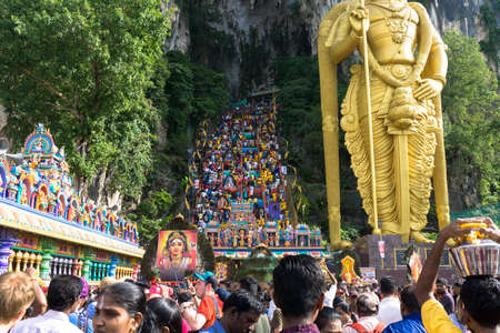 BATU CAVES, MALAYSIA - January 21, 2019: A celebration and devotee carrying kavadi preparing for ceremony prayers blessings during Thaipusam festival.のeditorial素材