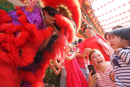 Kuala Lumpur, Malaysia - February 5, 2019: Beautiful Lion Dance during Chinese New Year celebration in Thean Hou Temple.のeditorial素材