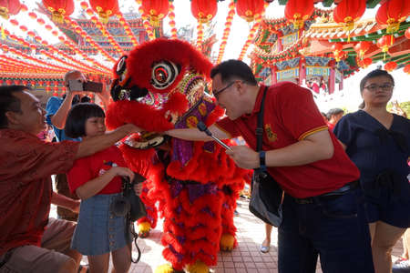 Kuala Lumpur, Malaysia - February 5, 2019: Beautiful Lion Dance during Chinese New Year celebration in Thean Hou Temple.のeditorial素材