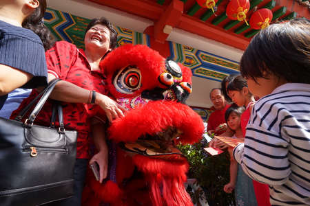 Kuala Lumpur, Malaysia - February 5, 2019: Beautiful Lion Dance during Chinese New Year celebration in Thean Hou Temple.のeditorial素材