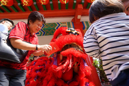Kuala Lumpur, Malaysia - February 5, 2019: Beautiful Lion Dance during Chinese New Year celebration in Thean Hou Temple.のeditorial素材