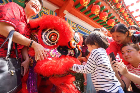 Kuala Lumpur, Malaysia - February 5, 2019: Beautiful Lion Dance during Chinese New Year celebration in Thean Hou Temple.のeditorial素材