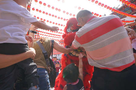 Kuala Lumpur, Malaysia - February 5, 2019: Beautiful Lion Dance during Chinese New Year celebration in Thean Hou Temple.のeditorial素材