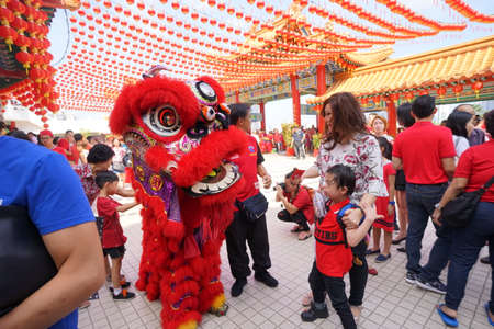Kuala Lumpur, Malaysia - February 5, 2019: Beautiful Lion Dance during Chinese New Year celebration in Thean Hou Temple.のeditorial素材