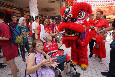 Kuala Lumpur, Malaysia - February 5, 2019: Beautiful Lion Dance during Chinese New Year celebration in Thean Hou Temple.のeditorial素材