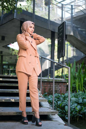 Cyberjaya, Malaysia â 25 December 2019: Fashion portraiture of young beautiful muslim woman wearing hijab.のeditorial素材