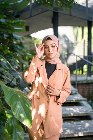 Cyberjaya, Malaysia â 25 December 2019: Fashion portraiture of young beautiful muslim woman wearing hijab.のeditorial素材
