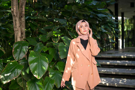 Cyberjaya, Malaysia â 25 December 2019: Fashion portraiture of young beautiful muslim woman wearing hijab.のeditorial素材