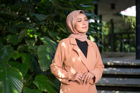 Cyberjaya, Malaysia â 25 December 2019: Fashion portraiture of young beautiful muslim woman wearing hijab.のeditorial素材